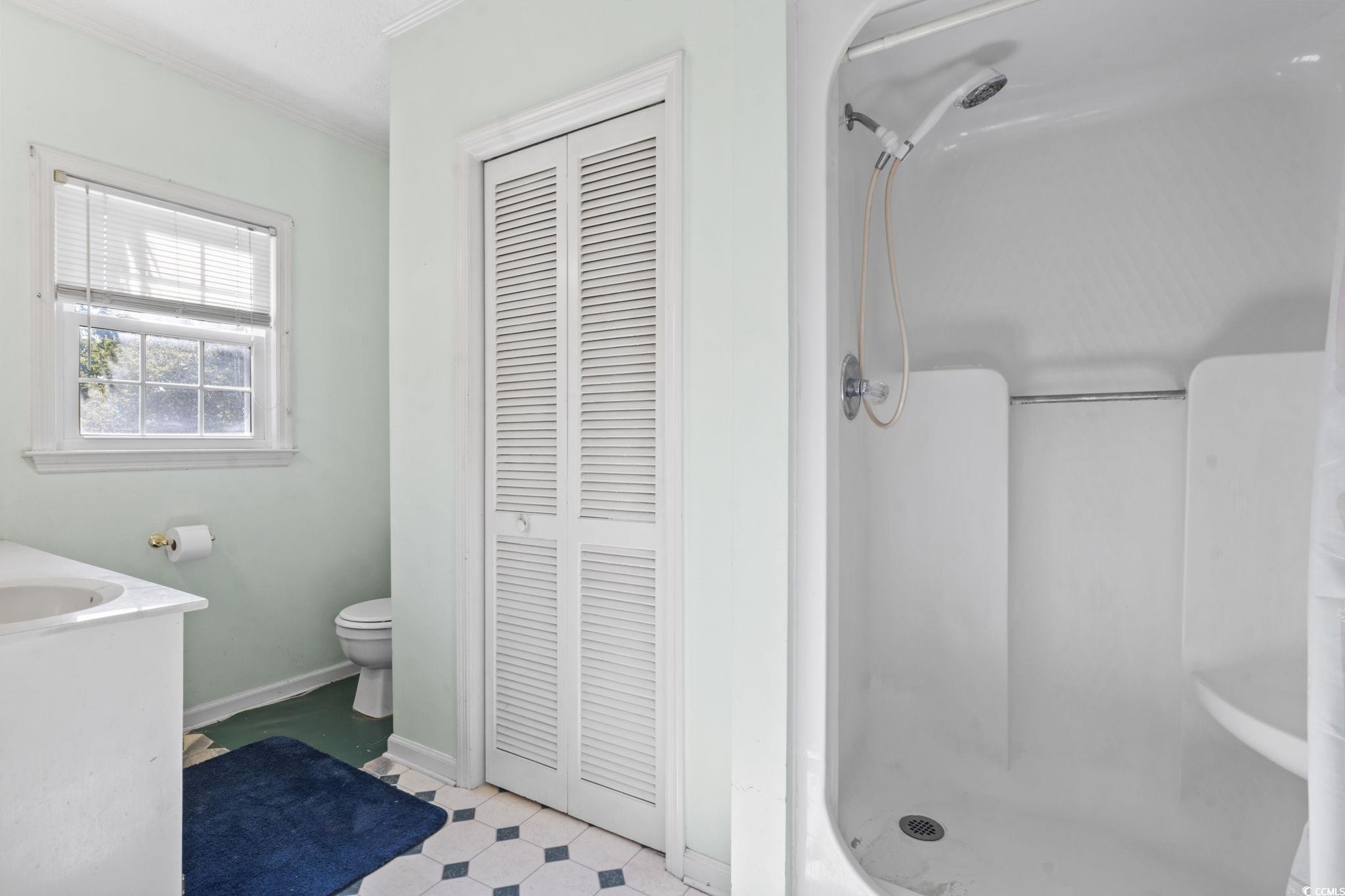 6971 Alfred Road Aynor, SC 29511 - Photo 19 of 37 Full bathroom with a closet, a stall shower, vanity, and ornamental molding