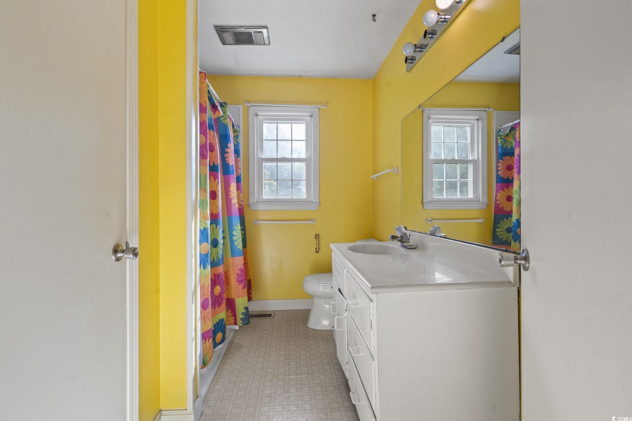 6971 Alfred Road Aynor, SC 29511 - Photo 25 of 37 Full bathroom with vanity, a shower with shower curtain, and light floors
