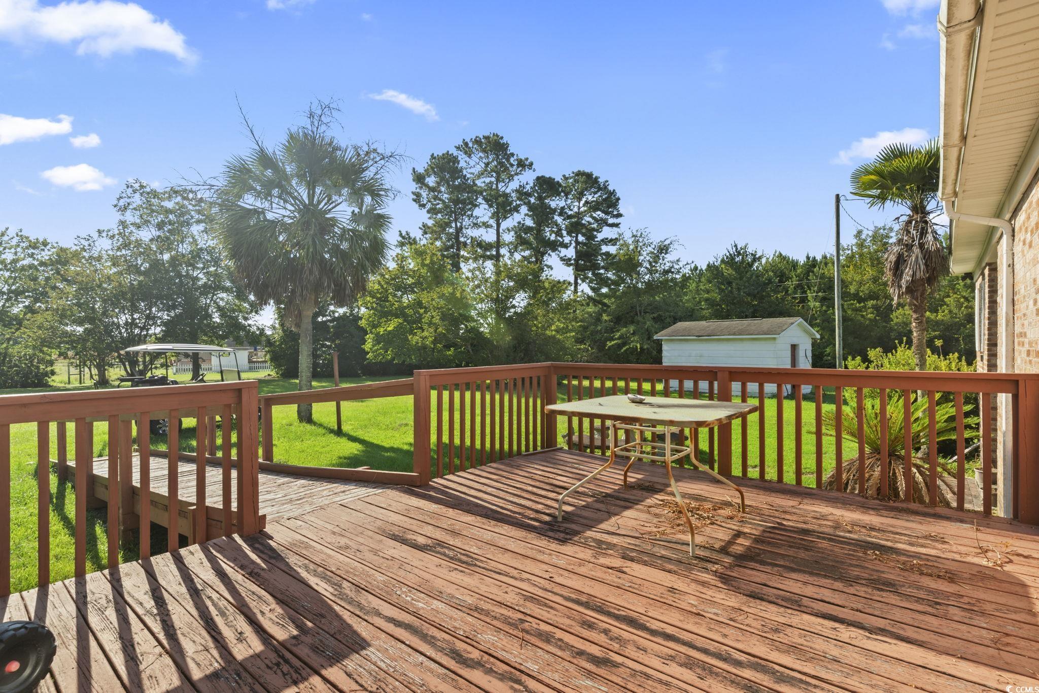 6971 Alfred Road Aynor, SC 29511 - Photo 33 of 37 Wooden deck featuring a yard and an outbuilding
