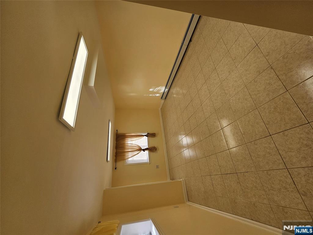 122 Eckel Road Little Ferry, NJ 07643 - Photo 11 of 16 a view of a room with an empty space and a window