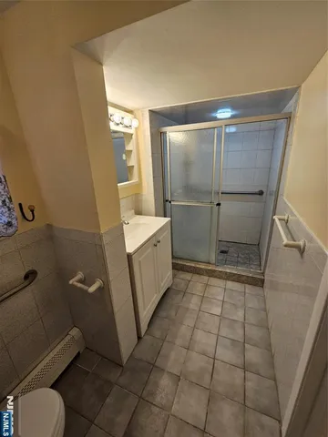 a kitchen with a sink a stove and cabinets