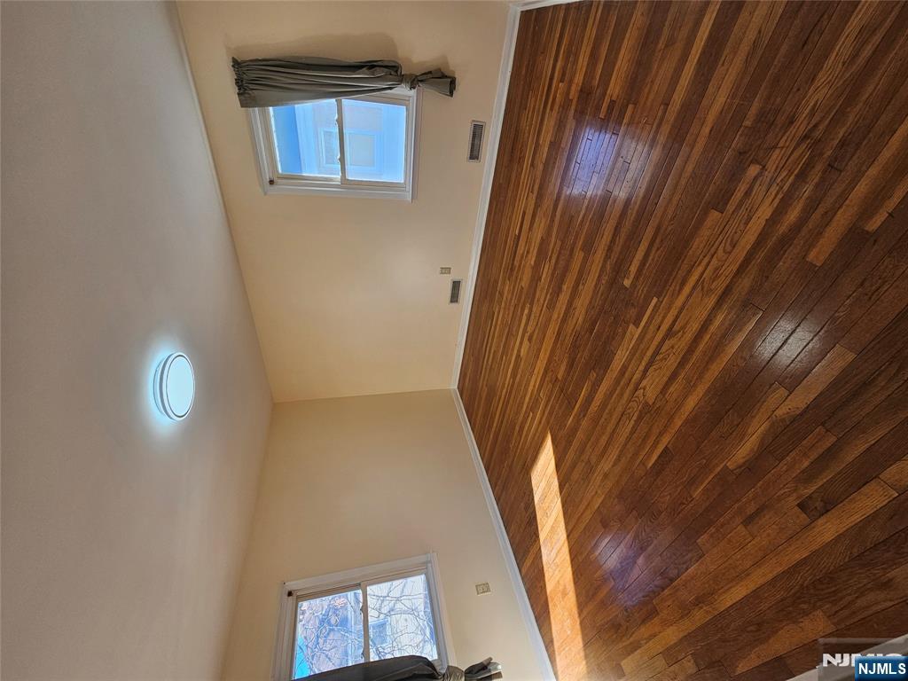 122 Eckel Road Little Ferry, NJ 07643 - Photo 7 of 16 a view of room with wooden floor and window