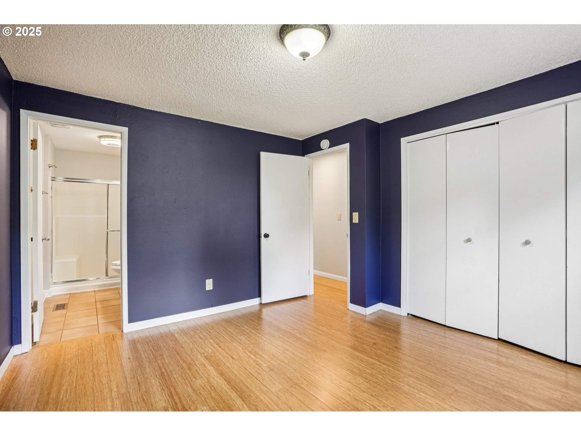 9281 Southwest Boones Ferry Road Portland, OR 97219 - Photo 14 of 27 a view of an empty room with wooden floor