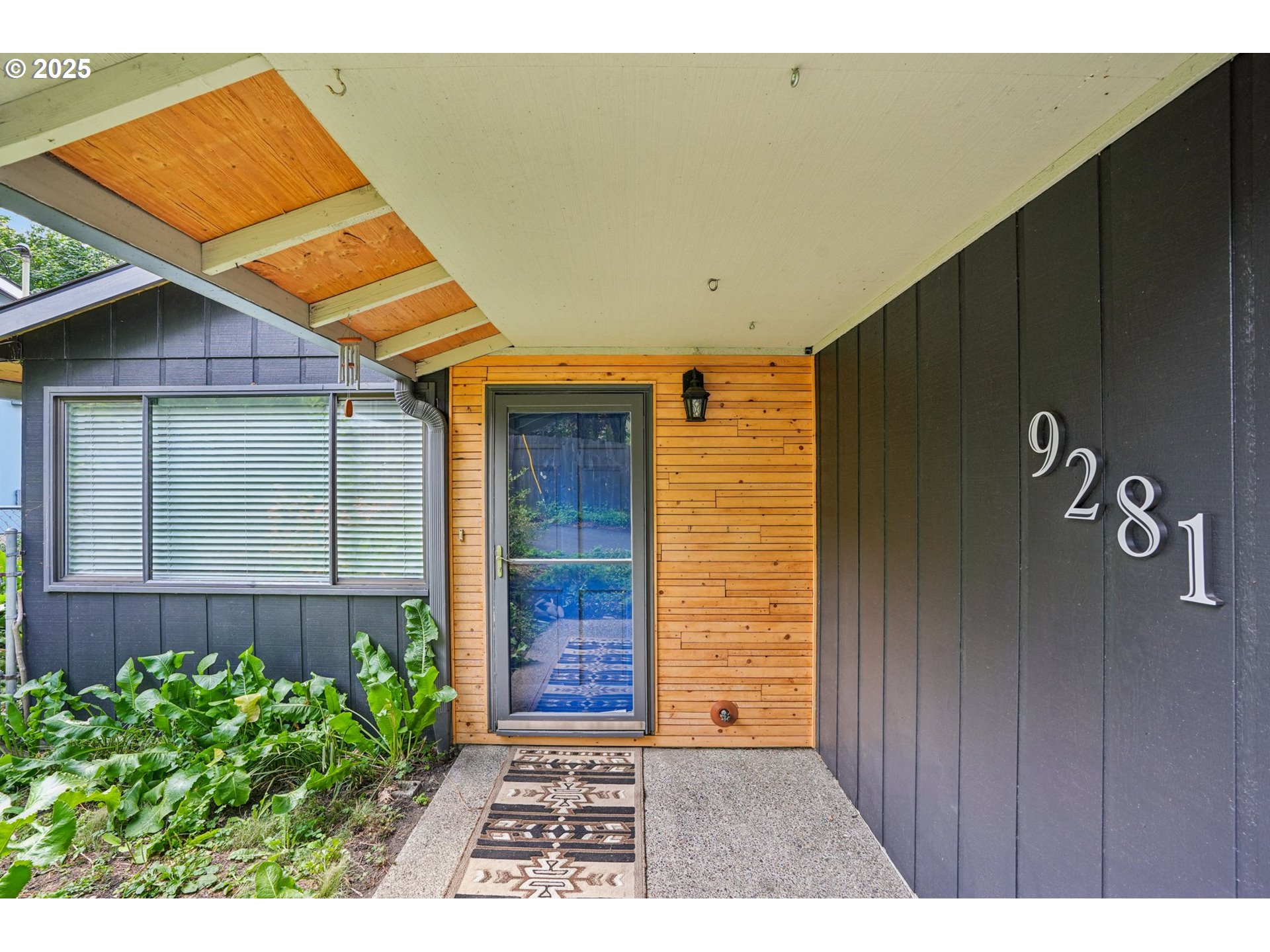 9281 Southwest Boones Ferry Road Portland, OR 97219 - Photo 3 of 27 a backyard of a house