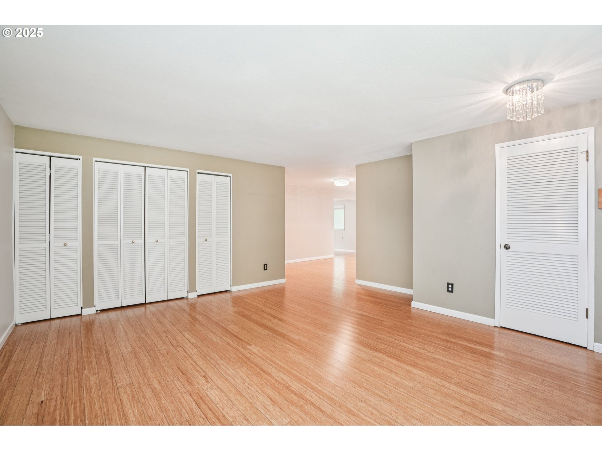 9281 Southwest Boones Ferry Road Portland, OR 97219 - Photo 5 of 27 a view of an empty room with wooden floor