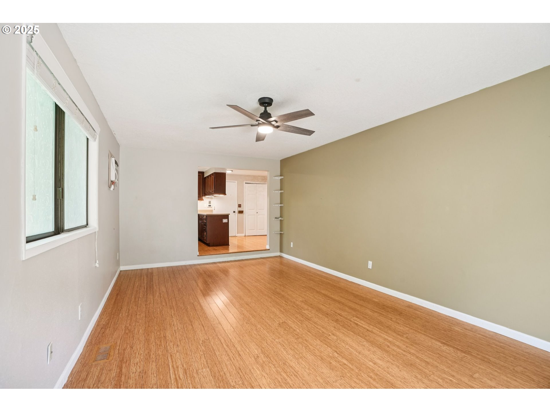 9281 Southwest Boones Ferry Road Portland, OR 97219 - Photo 8 of 27 a view of an empty room with a window