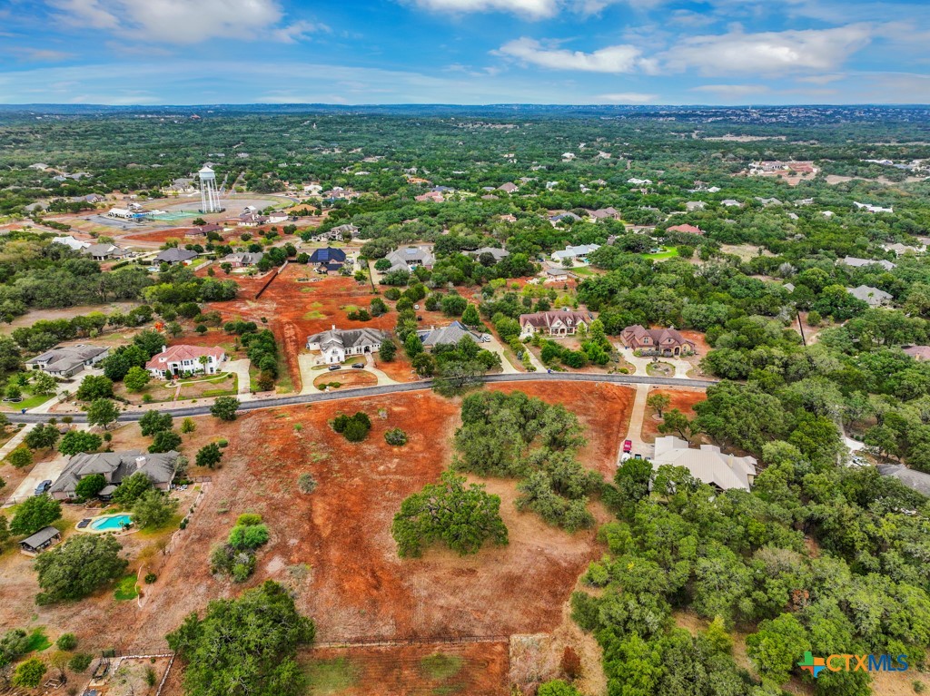 27215 Park Loop Road New Braunfels, TX 78132 - Photo 20 of 32 an aerial view of residential houses with outdoor space and trees