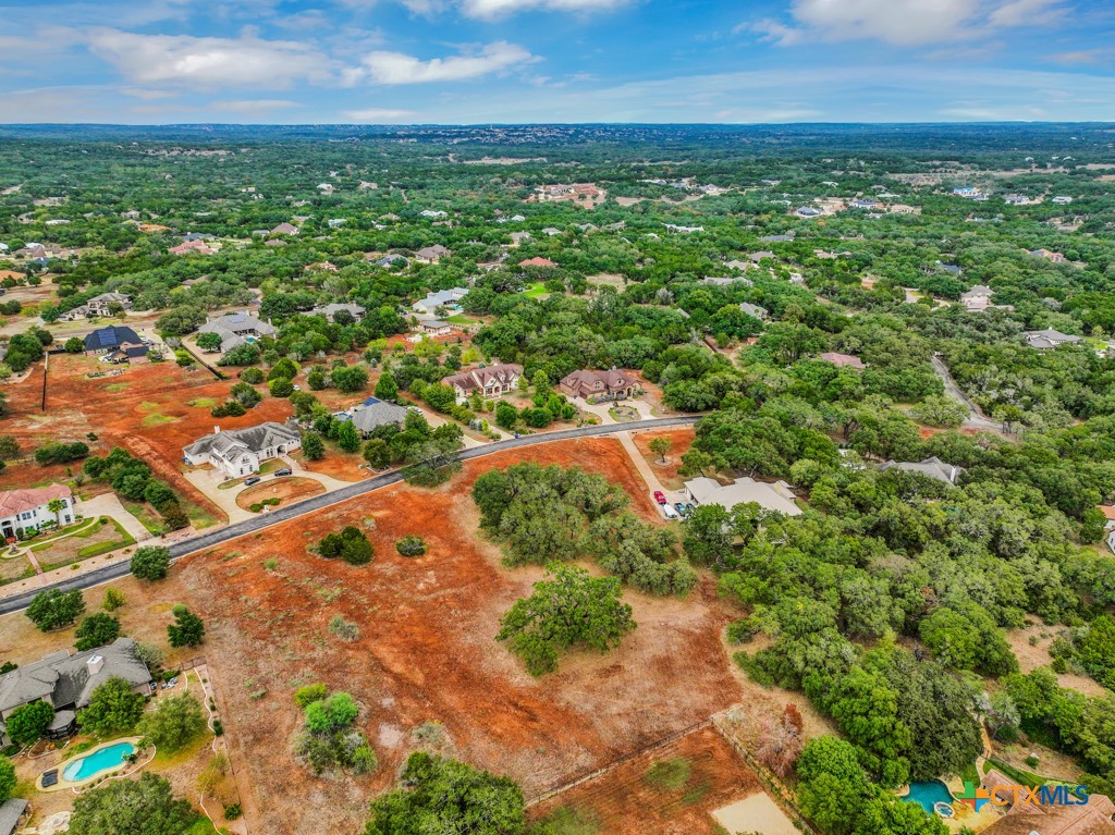 27215 Park Loop Road New Braunfels, TX 78132 - Photo 21 of 32 an aerial view of residential houses with outdoor space and trees