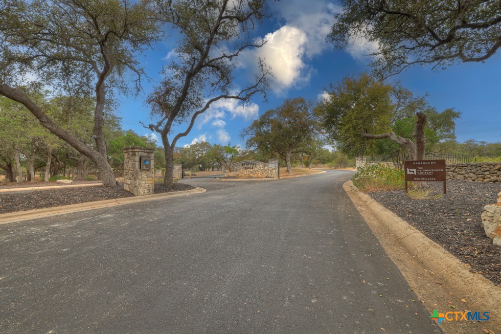 27215 Park Loop Road New Braunfels, TX 78132 - Photo 26 of 32 a view of a street with a building in the background