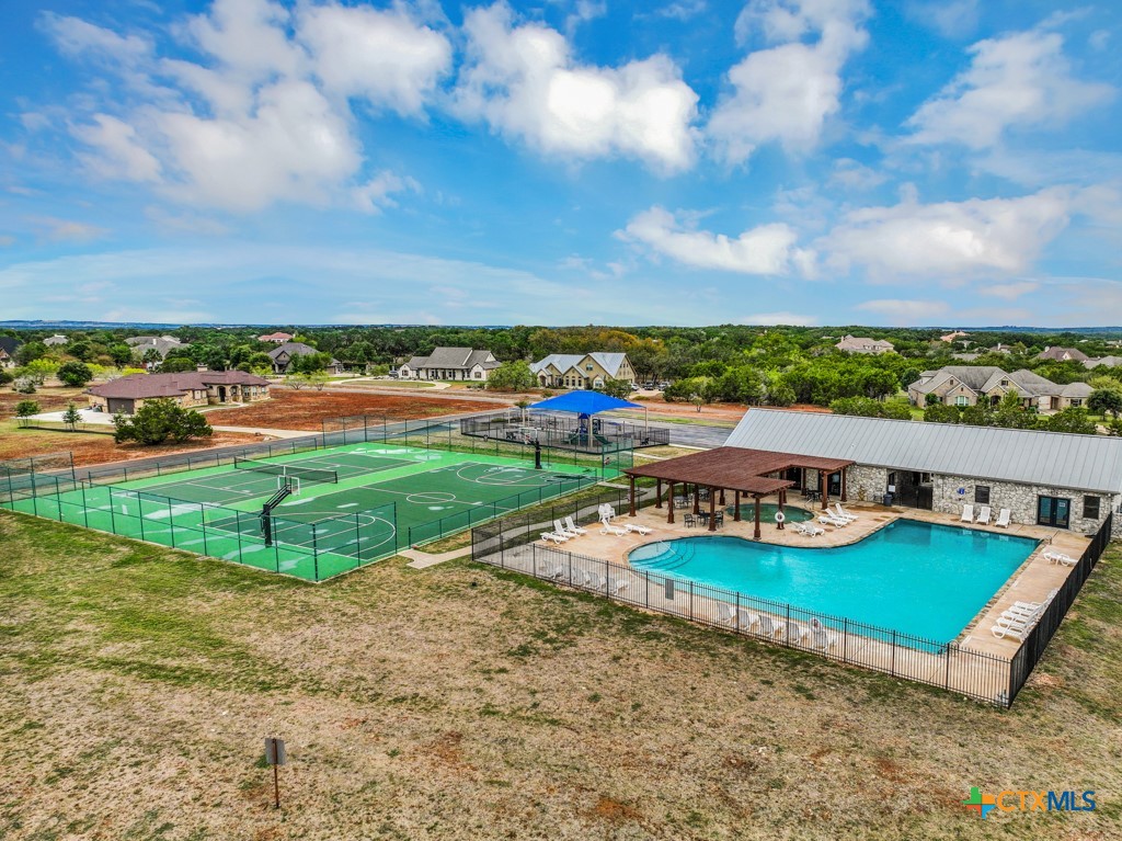 27215 Park Loop Road New Braunfels, TX 78132 - Photo 30 of 32 a view of a swimming pool and lounge chairs