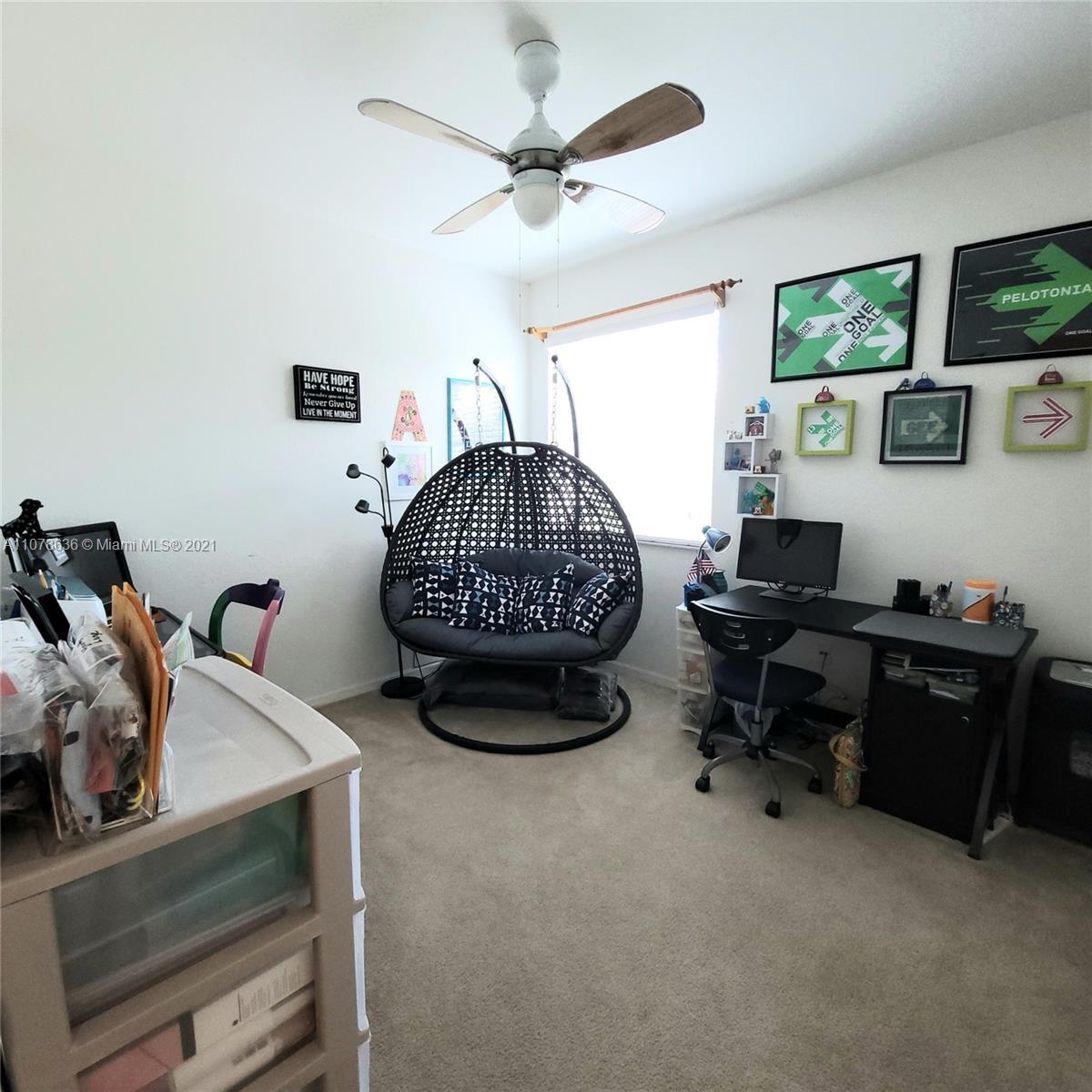 Keys Gate Homestead, FL 33035 - Photo 15 of 26 a room with furniture and a flat screen tv