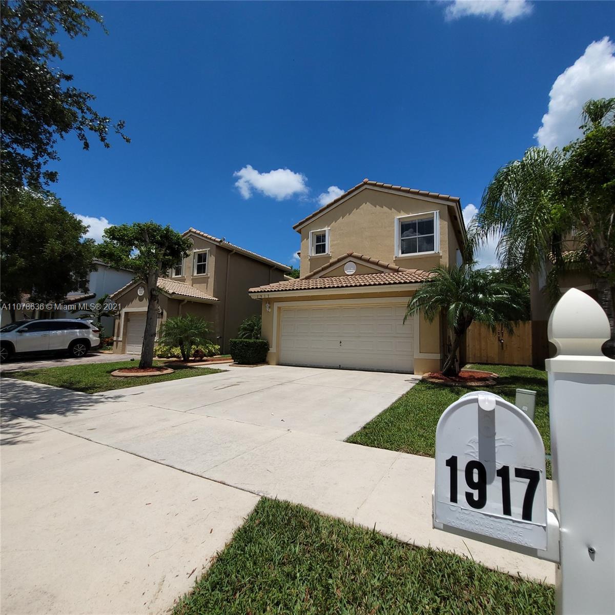 Keys Gate Homestead, FL 33035 - Photo 2 of 26 a front view of a house with garden