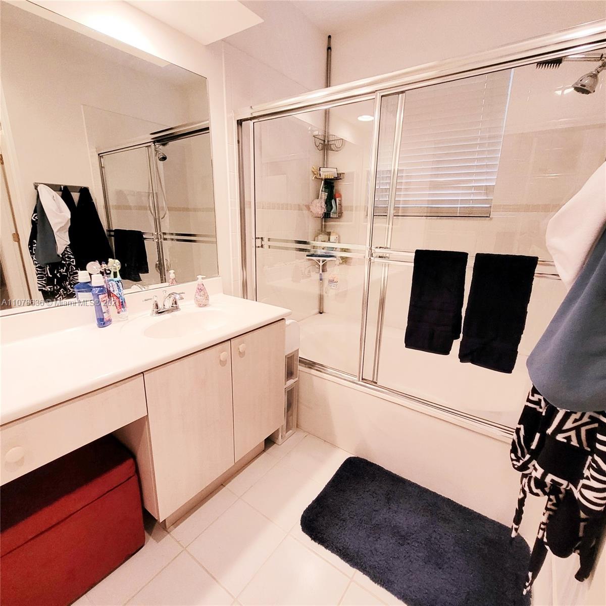 Keys Gate Homestead, FL 33035 - Photo 21 of 26 a bathroom with a sink a toilet a shower and a mirror