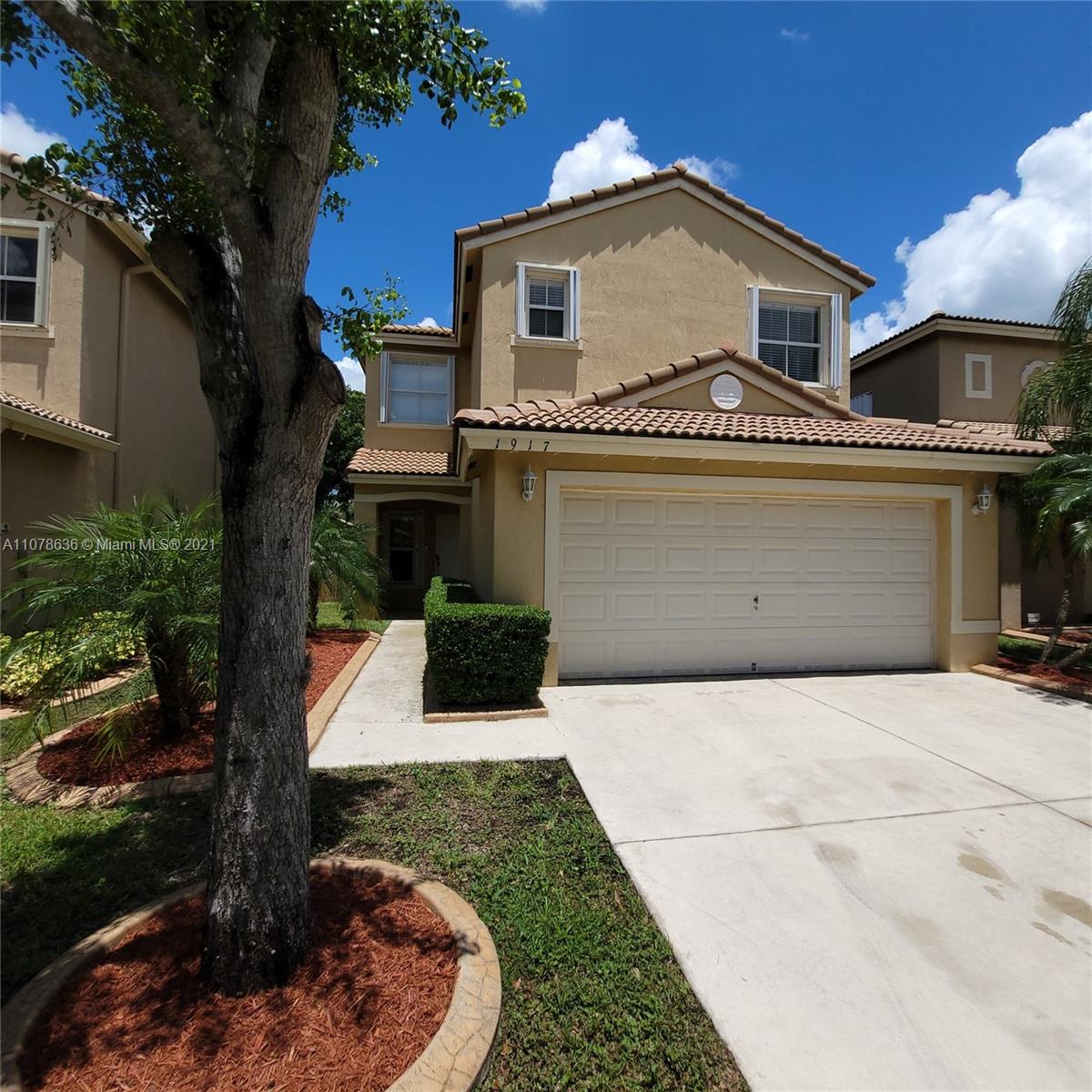 Keys Gate Homestead, FL 33035 - Photo 3 of 26 a front view of a house with garden