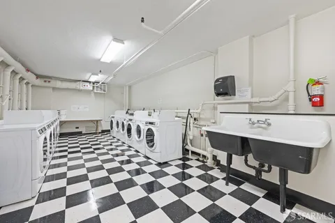 a living room with furniture and large glass door