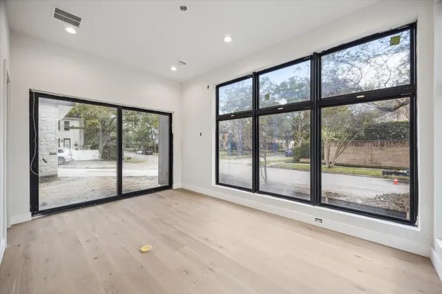 a view of empty room with floor to ceiling window