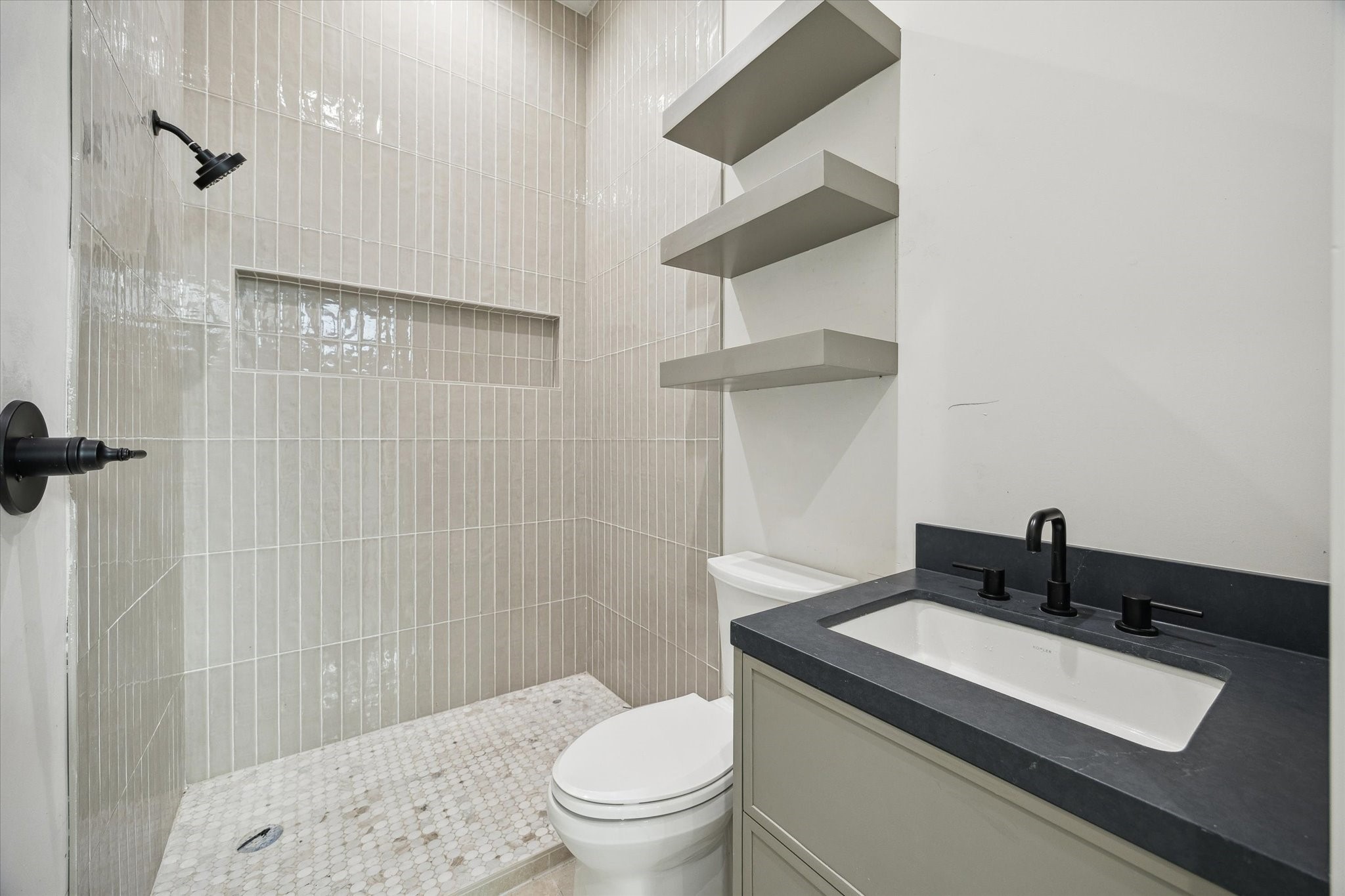 2102 Tangley Street Houston, TX 77005 - Photo 23 of 30 a bathroom with a sink a toilet and shower