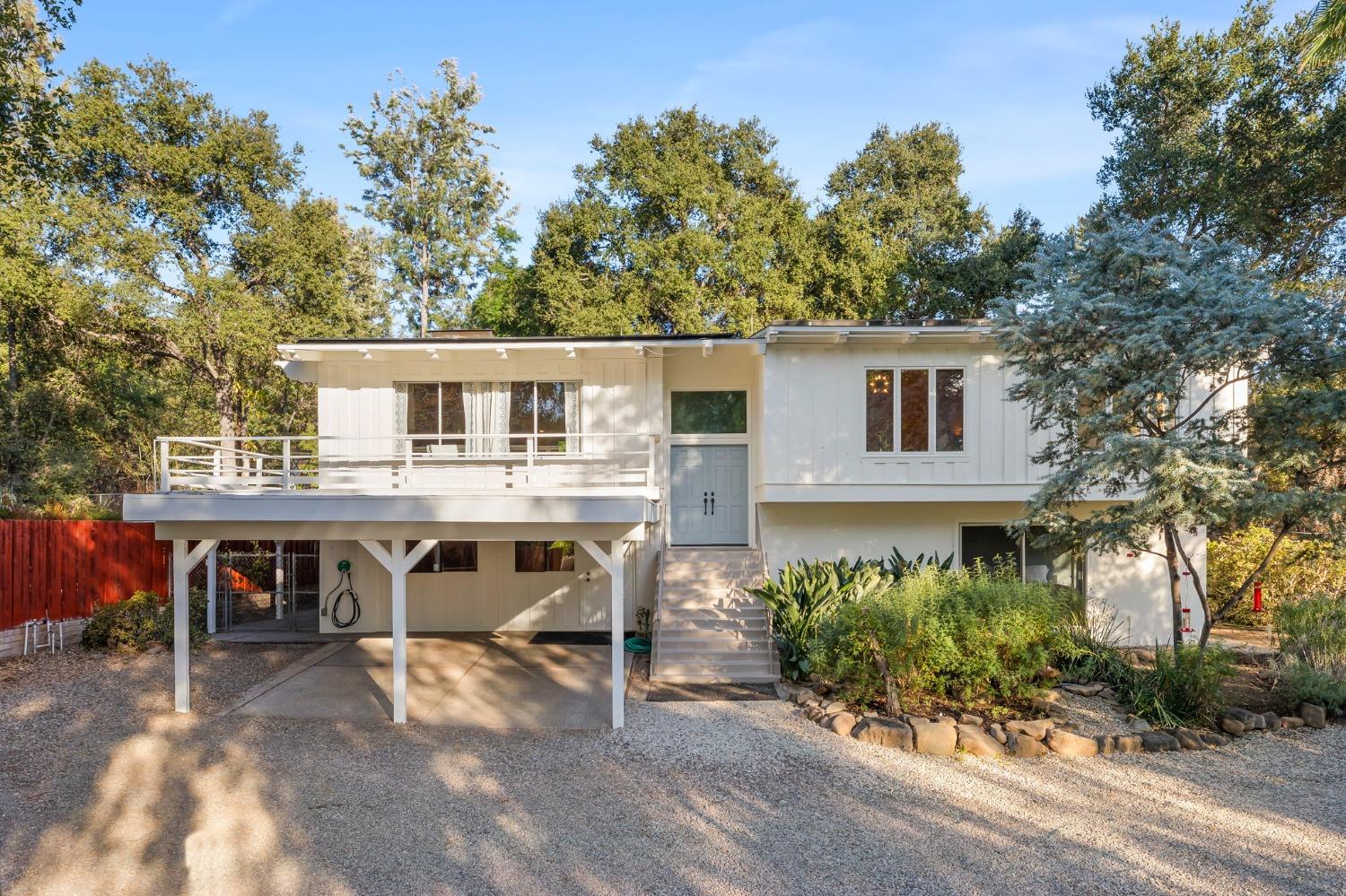 4306 Hendrickson Road Ojai, CA 93023 - Photo 1 of 44 a view of a house with backyard porch and sitting area