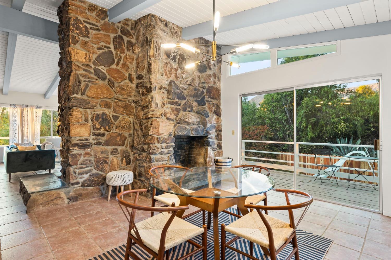 4306 Hendrickson Road Ojai, CA 93023 - Photo 22 of 44 a living room with patio furniture and a fireplace