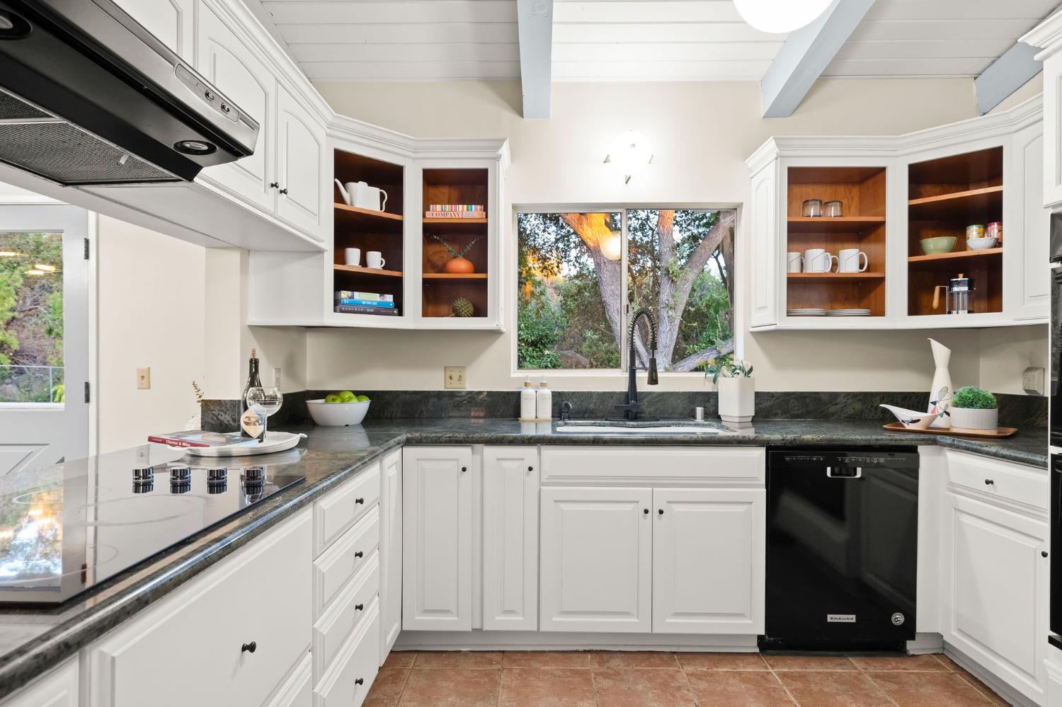 4306 Hendrickson Road Ojai, CA 93023 - Photo 24 of 44 a kitchen with stainless steel appliances granite countertop a sink and cabinets