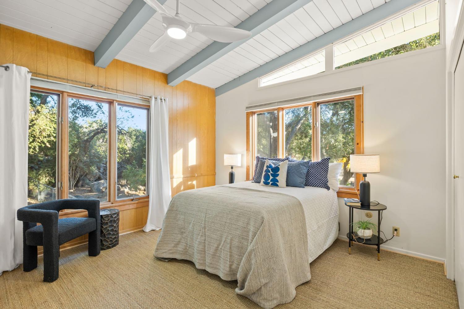 4306 Hendrickson Road Ojai, CA 93023 - Photo 26 of 44 a bedroom with a bed and a large window