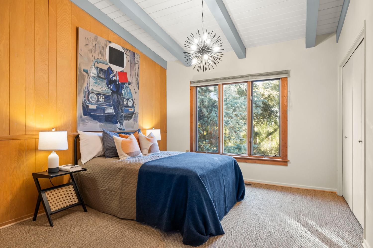 4306 Hendrickson Road Ojai, CA 93023 - Photo 32 of 44 a bedroom with a bed and a lamp next to a window