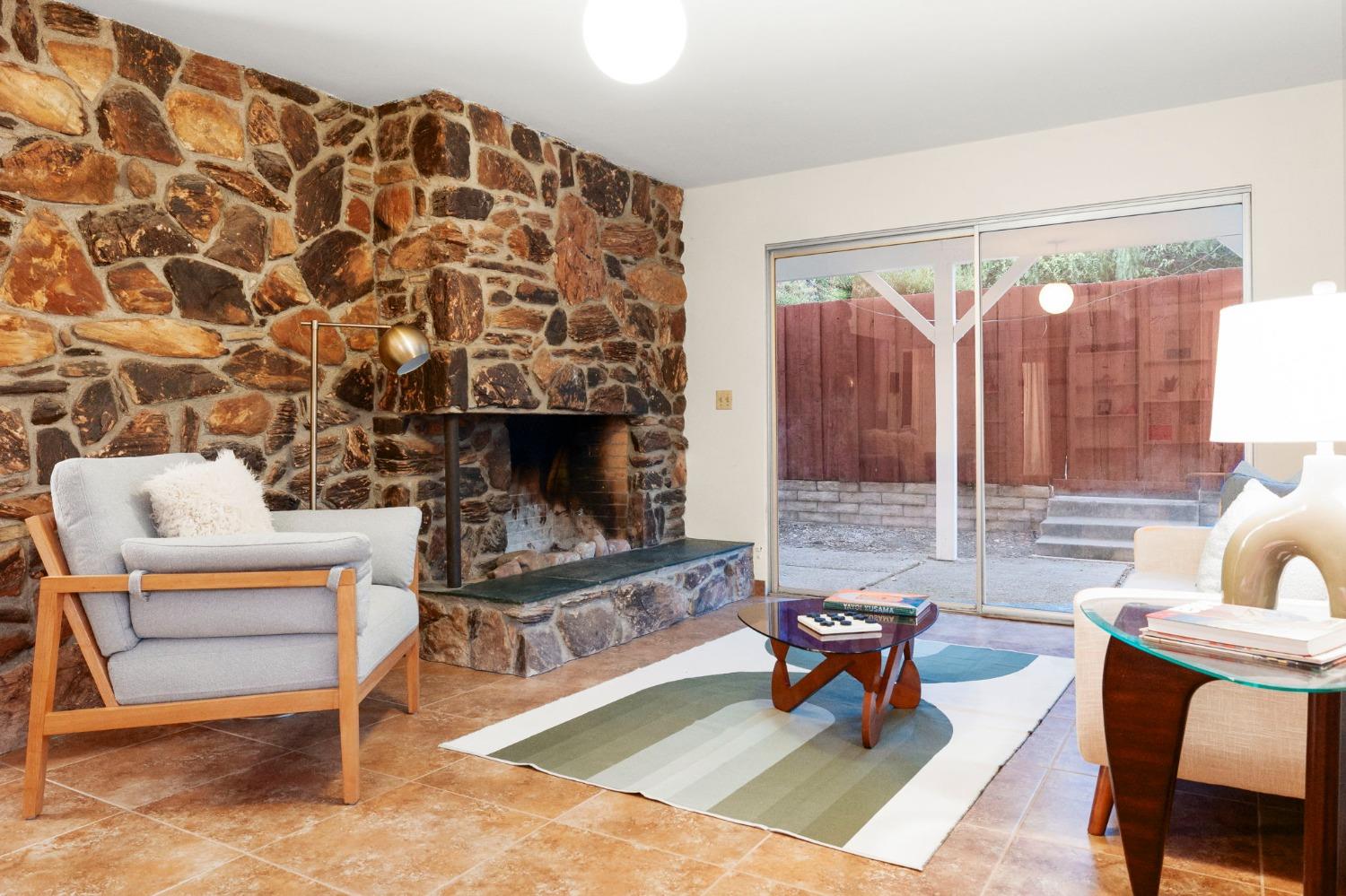 4306 Hendrickson Road Ojai, CA 93023 - Photo 35 of 44 a living room with furniture and a fireplace