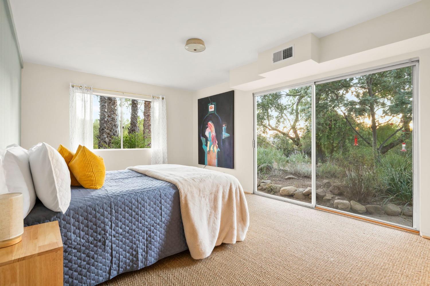 4306 Hendrickson Road Ojai, CA 93023 - Photo 39 of 44 a bedroom with a bed and glass walk in closet