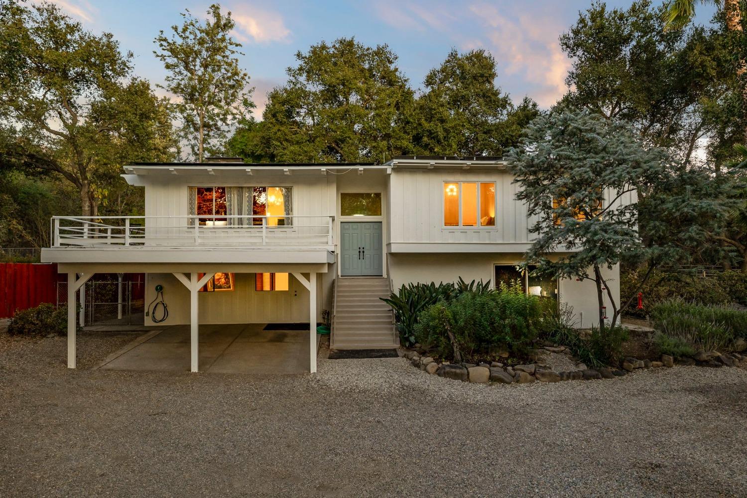 4306 Hendrickson Road Ojai, CA 93023 - Photo 5 of 44 a backyard of a house with plants and trees