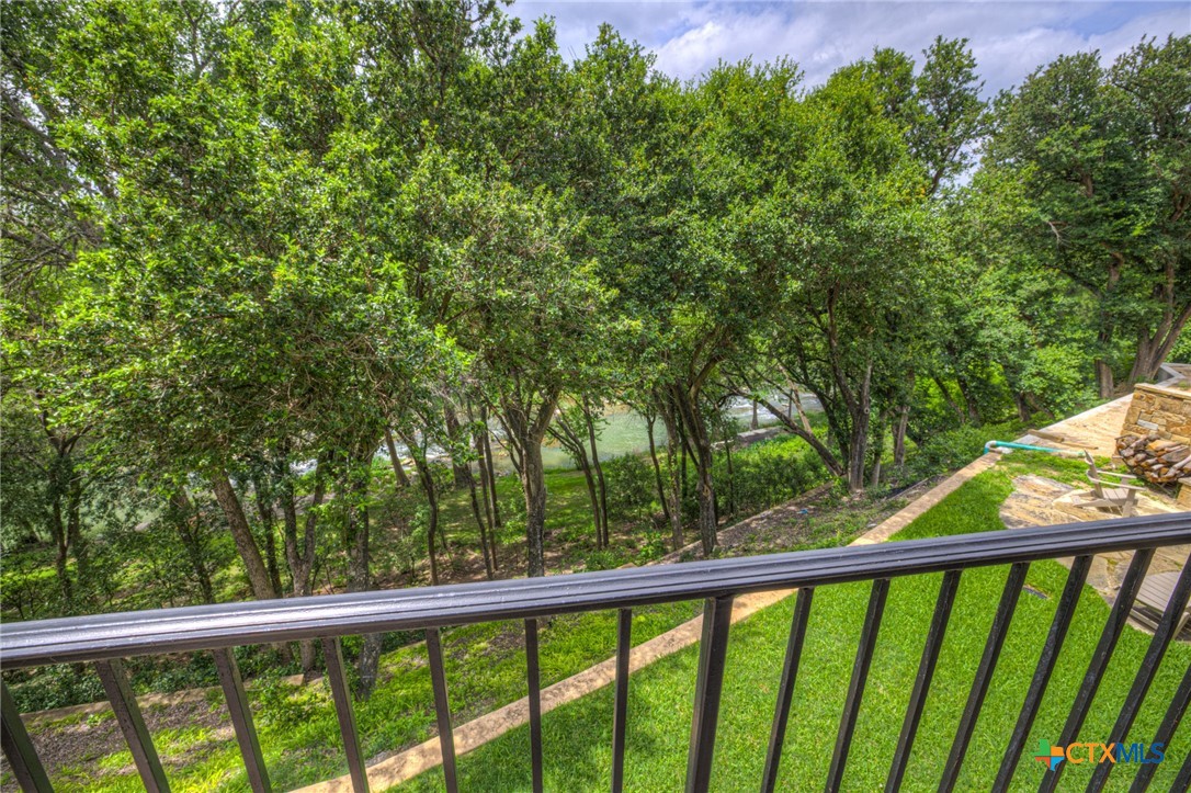 1029 Gruene Road New Braunfels, TX 78130 - Photo 29 of 48 a view of a green field with trees in the background