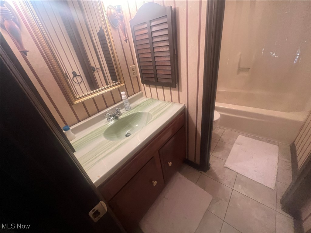 86301 North Bay Road Scio, OH 43988 - Photo 35 of 50 Full bathroom featuring toilet, shower combination, vanity, and tile patterned floors