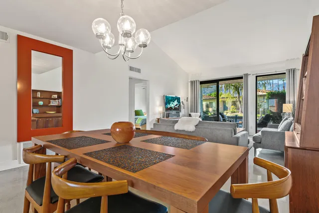 a kitchen with stainless steel appliances granite countertop a sink a stove and a microwave