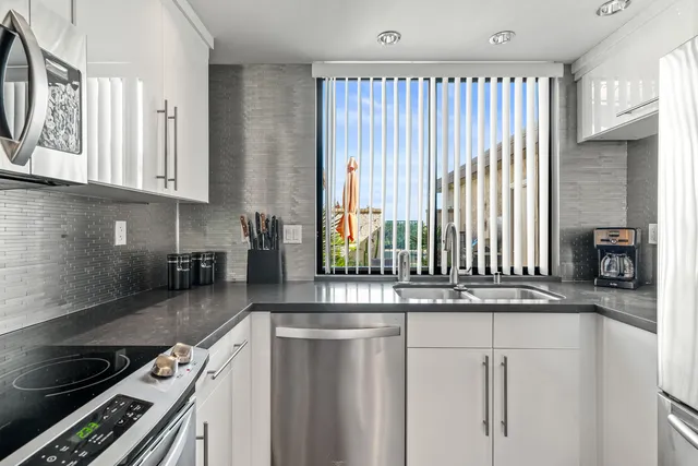 a bedroom with a bed and glass windows