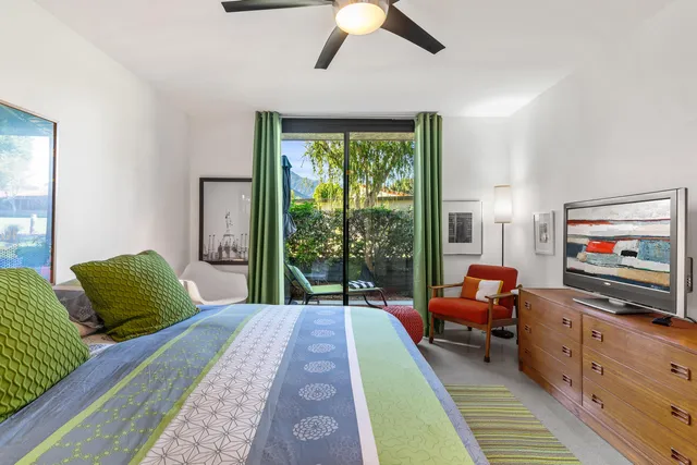 a view of a hallway to a livingroom and a livingroom with furniture