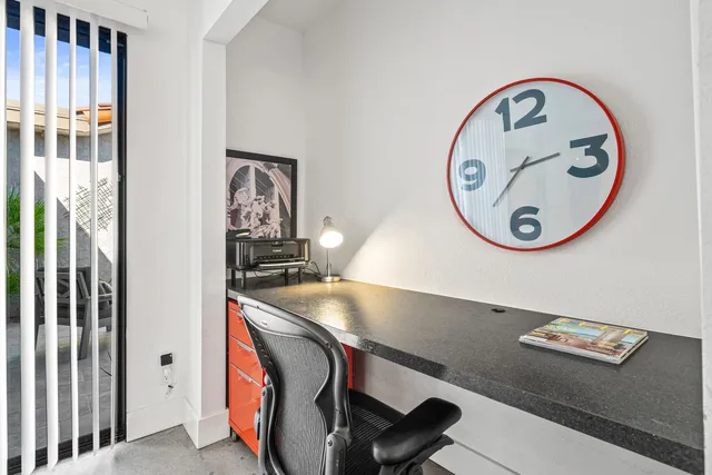 a view of a chairs and table in patio with a lake view