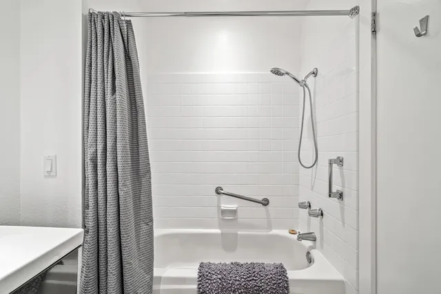 a view of a house with a yard and a wooden deck