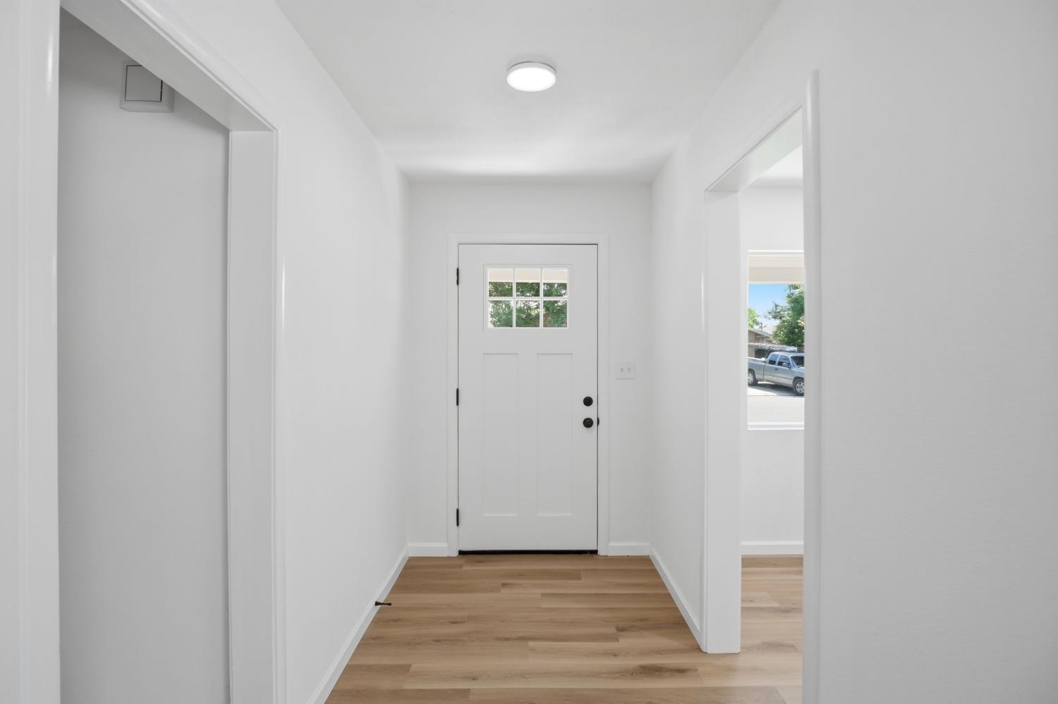 1451 Kent Way Modesto, CA 95355 - Photo 10 of 37 a view of a hallway with wooden floor and closet