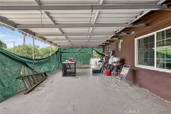 a view of a patio with table and chairs
