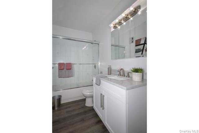 70 Middleton Road, Unit SF06 Bohemia, NY 11716 - Photo 11 of 11 a bathroom with a sink toilet and vanity
