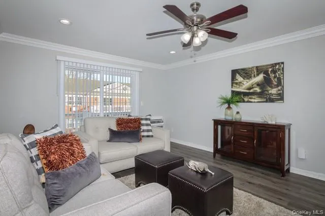 a living room with furniture and a window
