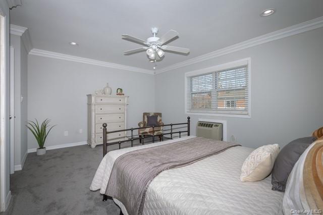 70 Middleton Road, Unit SF06 Bohemia, NY 11716 - Photo 8 of 11 a bedroom with a bed and ceiling fan