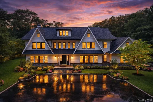 a front view of a house swimming pool and lake view