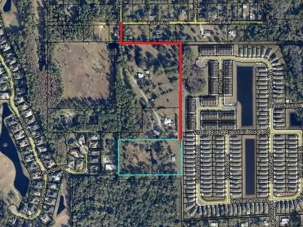 a view of a house with a tree