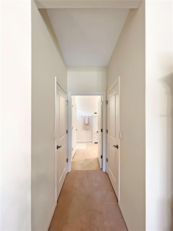 6265 Southwest 88th Loop Ocala, FL 34476 - Photo 17 of 42 a view of a hallway with wooden shelves