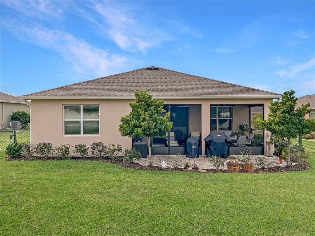 6265 Southwest 88th Loop Ocala, FL 34476 - Photo 18 of 42 front view of a house with a yard