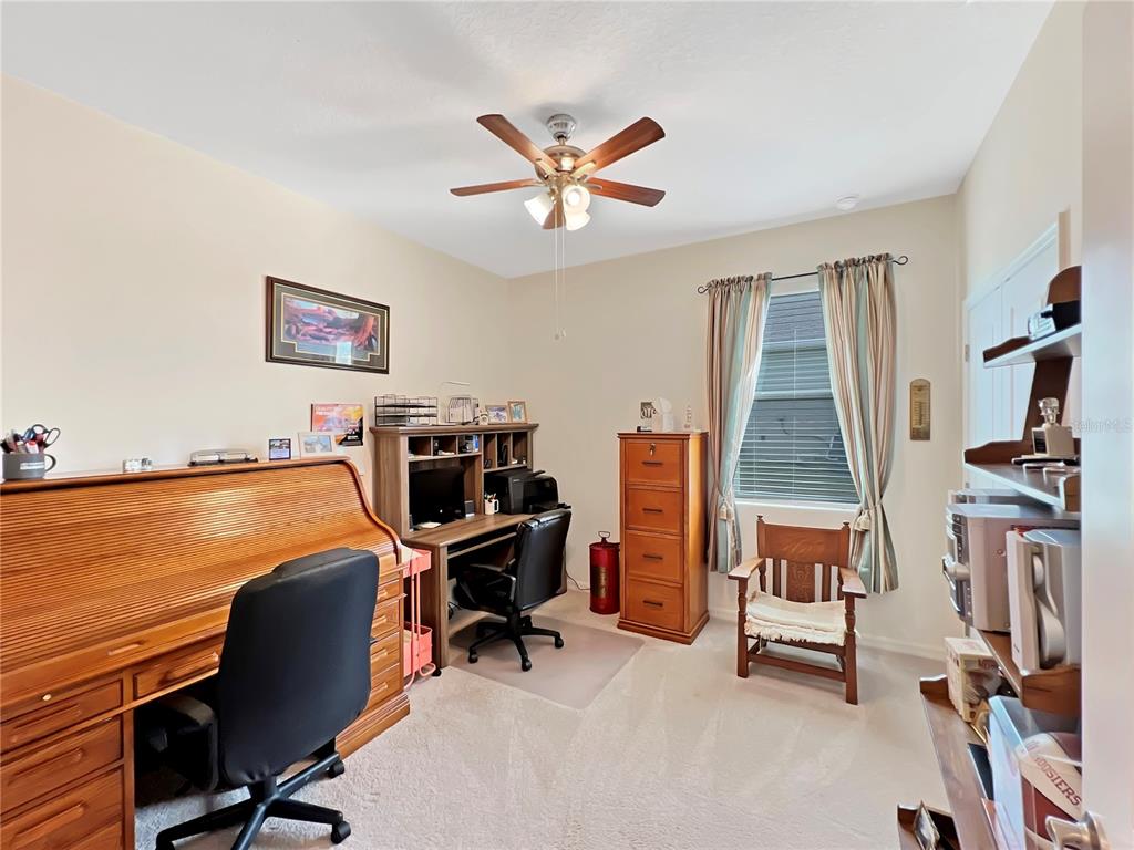 6265 Southwest 88th Loop Ocala, FL 34476 - Photo 20 of 42 a view of a workspace with furniture and a window