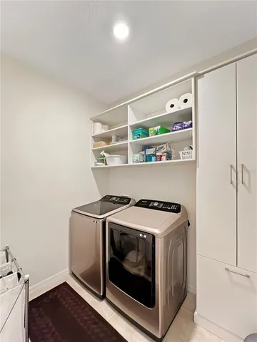 a utility room with washer and dryer
