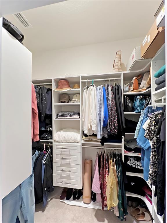 6265 Southwest 88th Loop Ocala, FL 34476 - Photo 31 of 42 a view of walk in closet with clothes and shoes