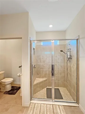 a bathroom with a shower and toilet