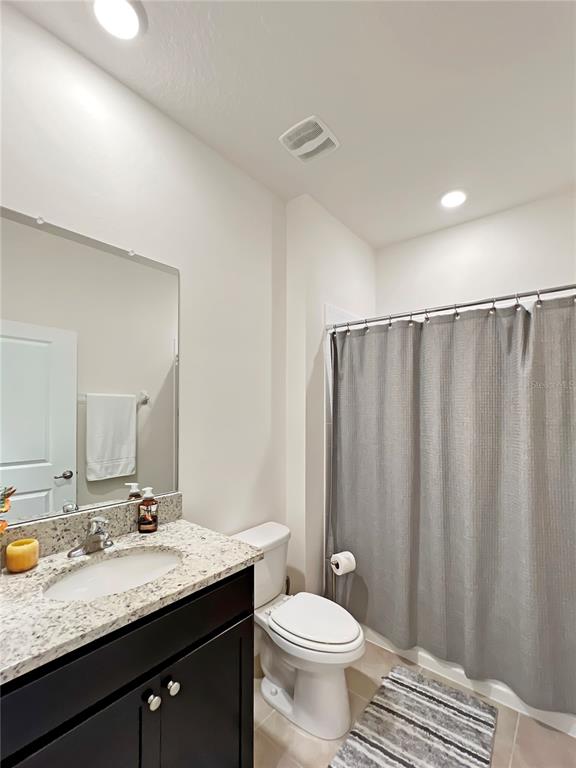 6265 Southwest 88th Loop Ocala, FL 34476 - Photo 34 of 42 a bathroom with a granite countertop sink and a mirror